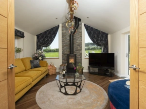 Living area with lots of comfortable seating and wood burner - Highfield Barton