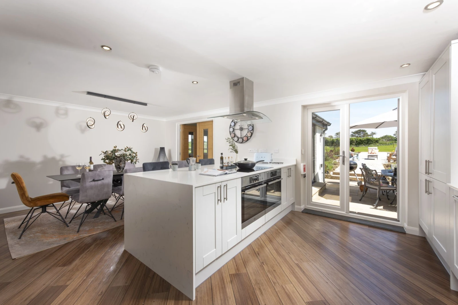Private doors to the patio and views of the garden from the kitchen - Highfield Barton