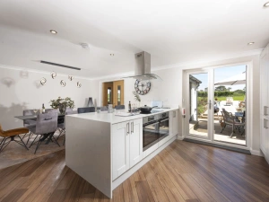 Private doors to the patio and views of the garden from the kitchen - Highfield Barton