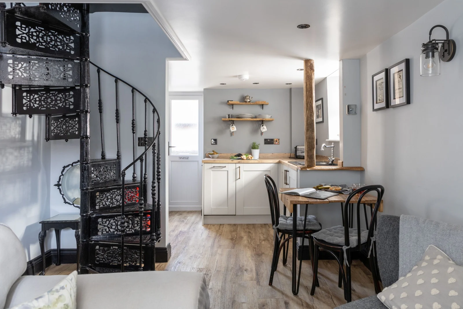 Open plan dining and kitchen area with stairs to upper floor - Apothecary Cottage