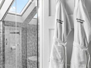 Shower room with bath robes - Apothecary Cottage