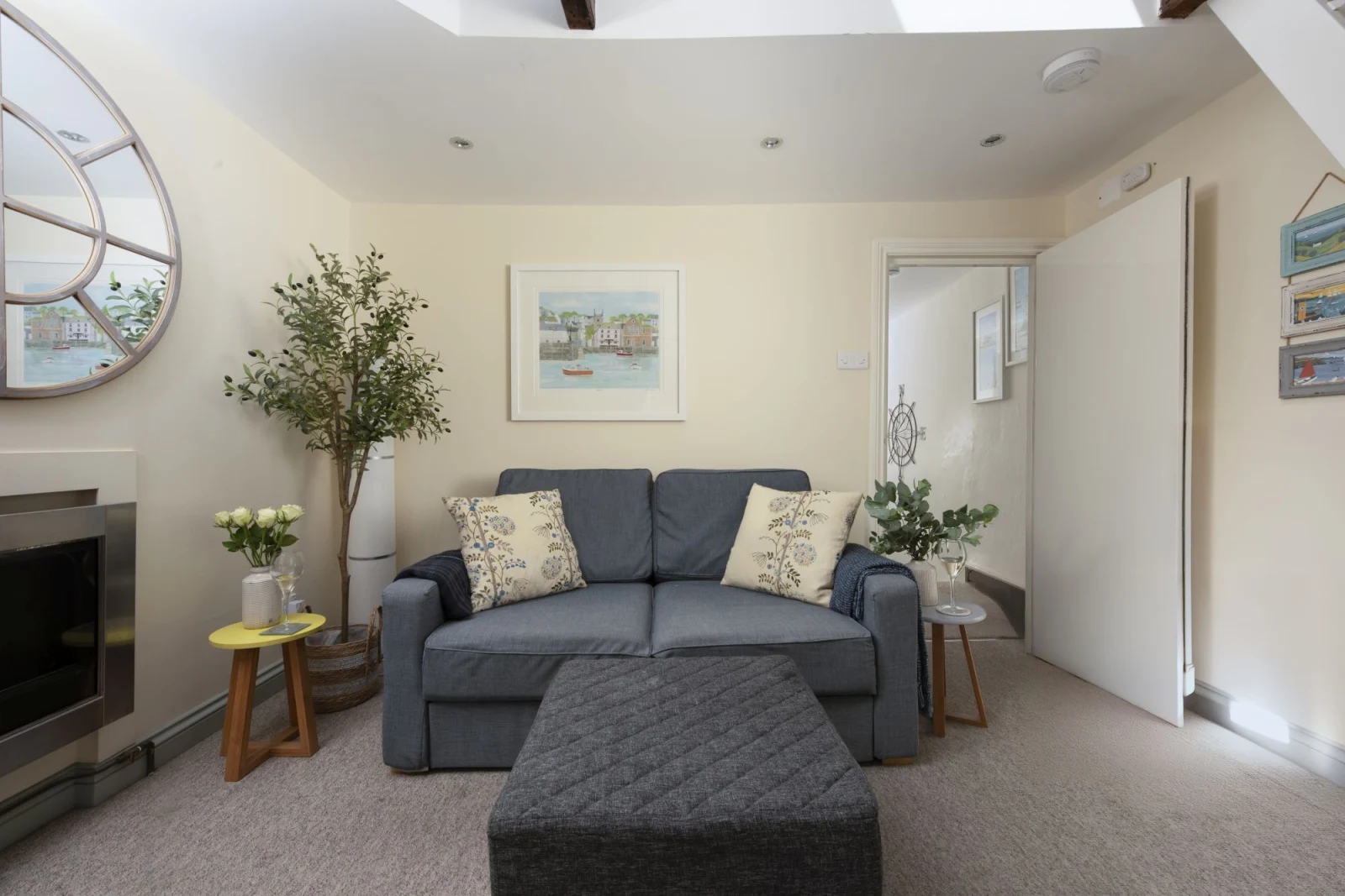 Sofa and foot stool in living room - Bessie Ellen's Cottage