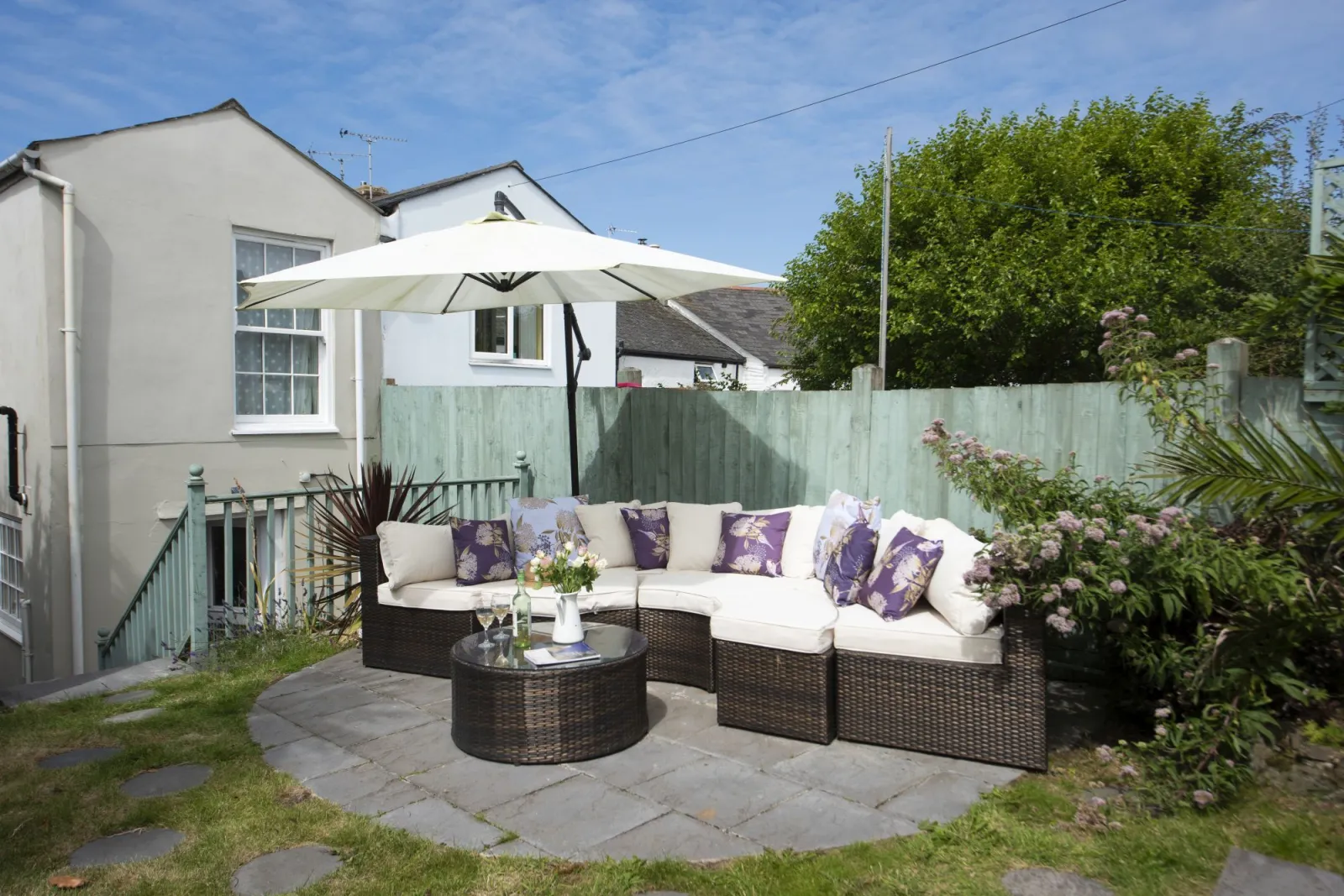 Terraced garden, family friendly with plenty of seating and grassed area - Almond Cottage