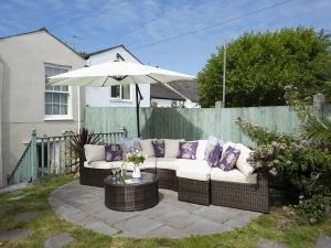 Terraced garden, family friendly with plenty of seating and grassed area - Almond Cottage