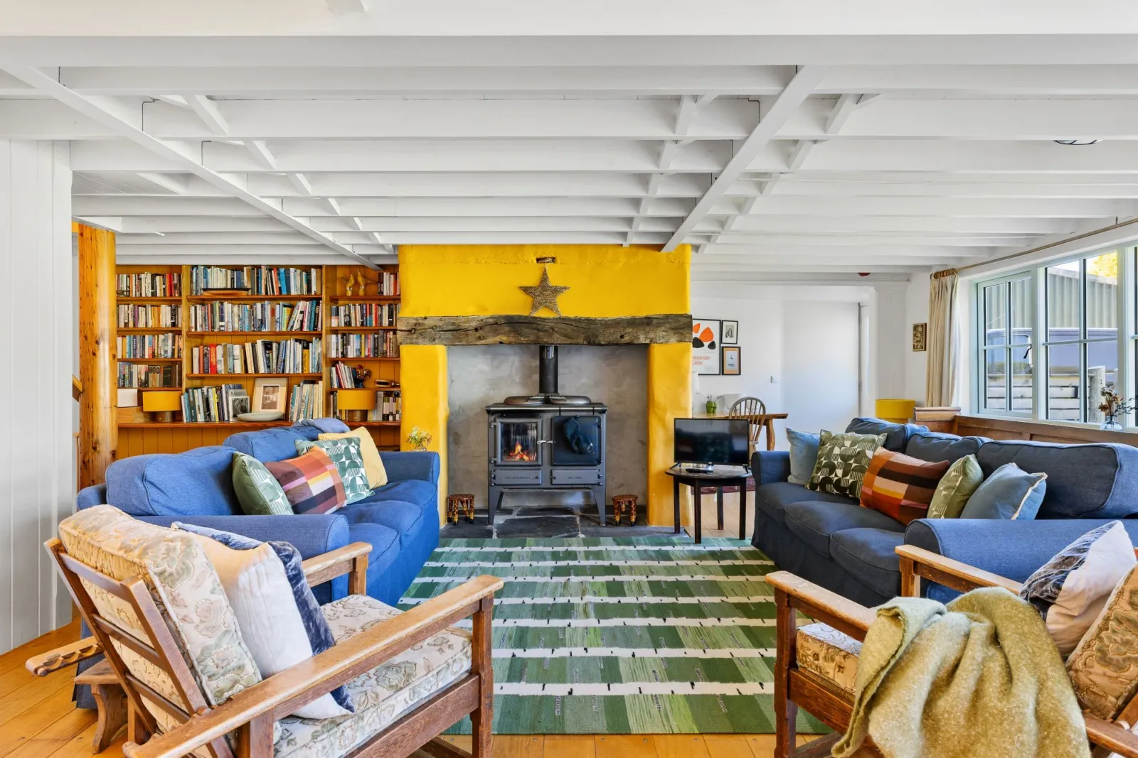 Living area with wood burning stove - Master Shipwrights House