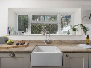 Kitchen area with garden view and sink - Trevethen Cottage