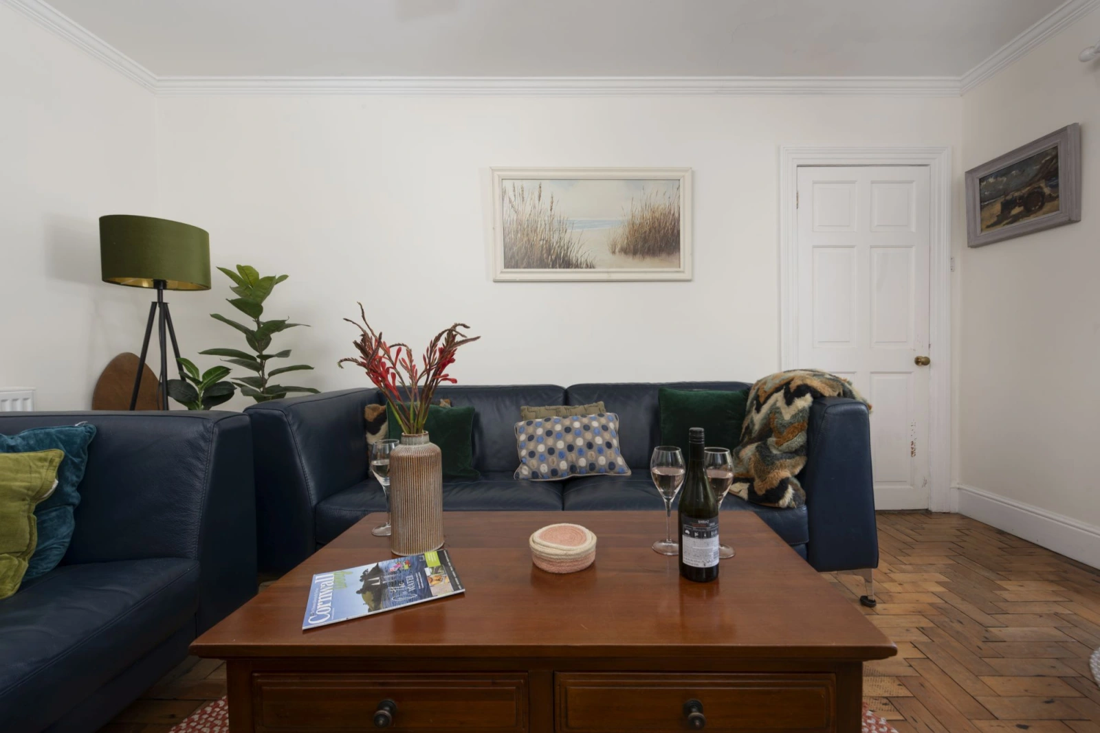 Living area with large coffee table - Trevethen Cottage