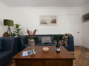Living area with large coffee table - Trevethen Cottage
