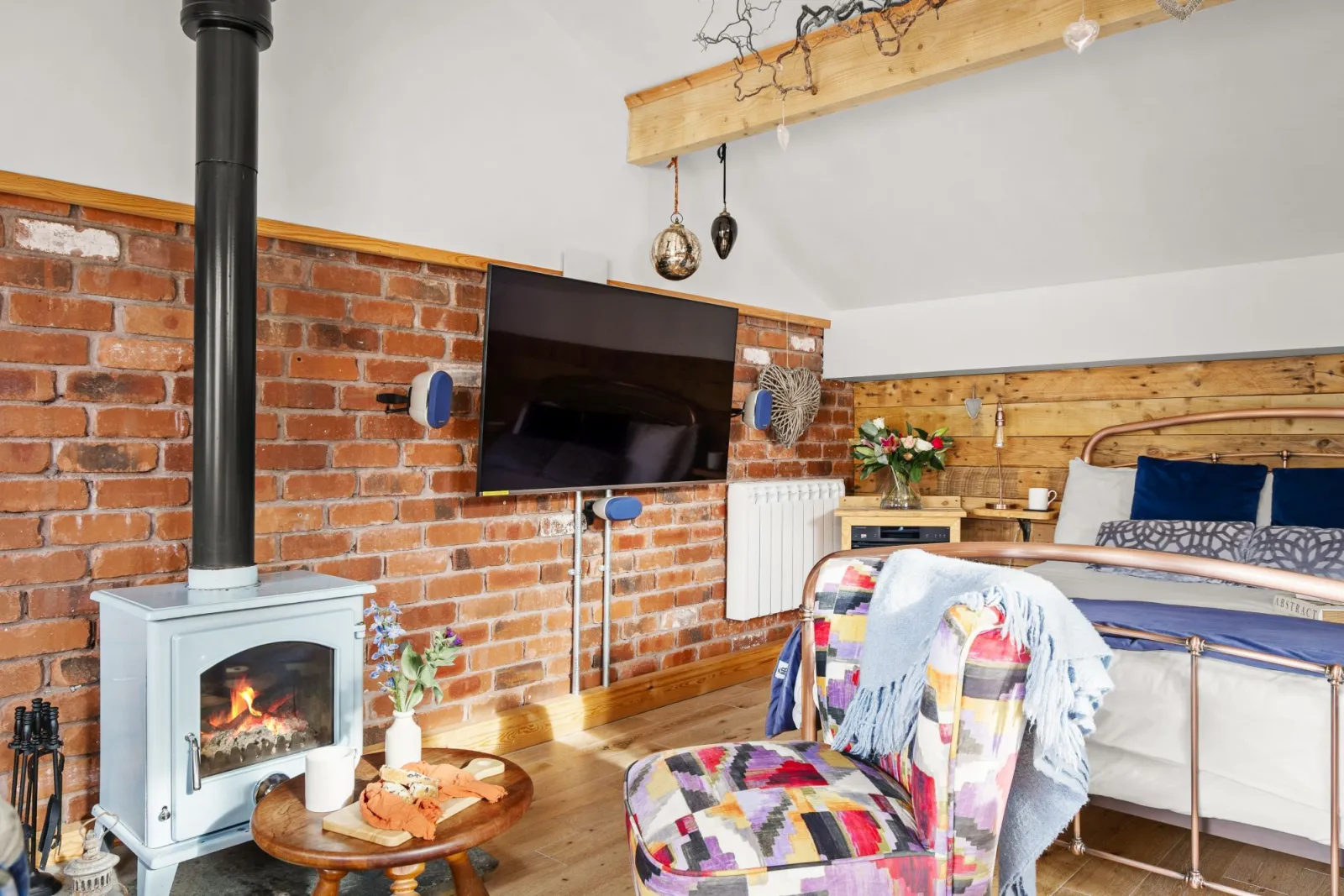 Comfy seating near the fireplace - Porth Chapel
