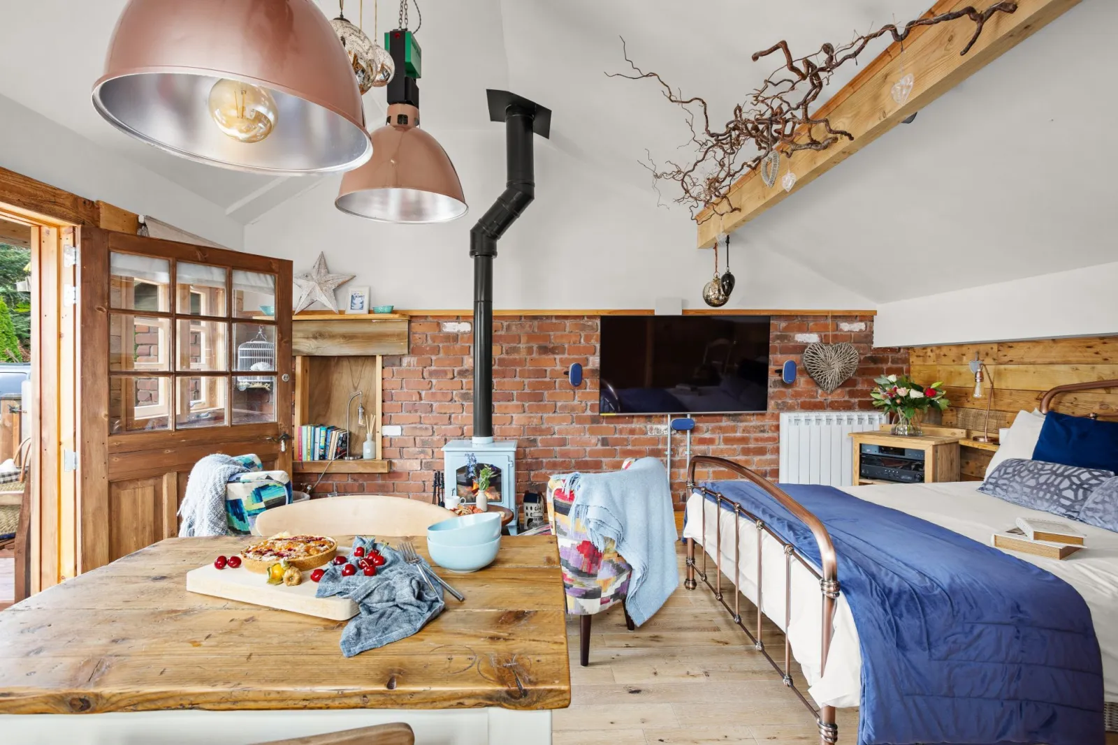 Wood burner, Open plan bedroom, Dining table -  Porth Chapel within Buryas bridge collection 