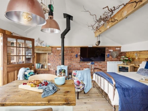 Wood burner, Open plan bedroom, Dining table -  Porth Chapel within Buryas bridge collection 