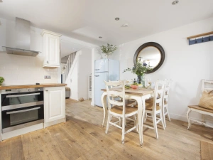 Kitchen and dining room with table seating six - Happy Days Cottage