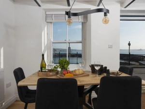 Dining area seating six with harbour views - Harbour Watch Cottage