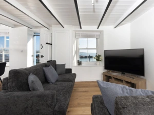 Living area with views over the Harbour - Harbour Watch Cottage
