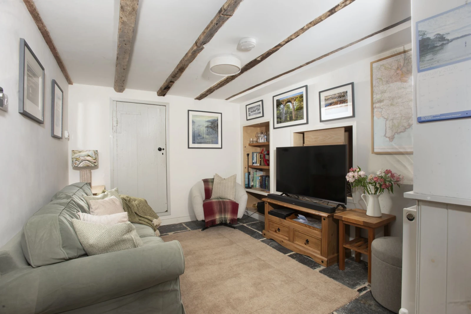 Living room with comfortable sofa, chair and TV - An Selder