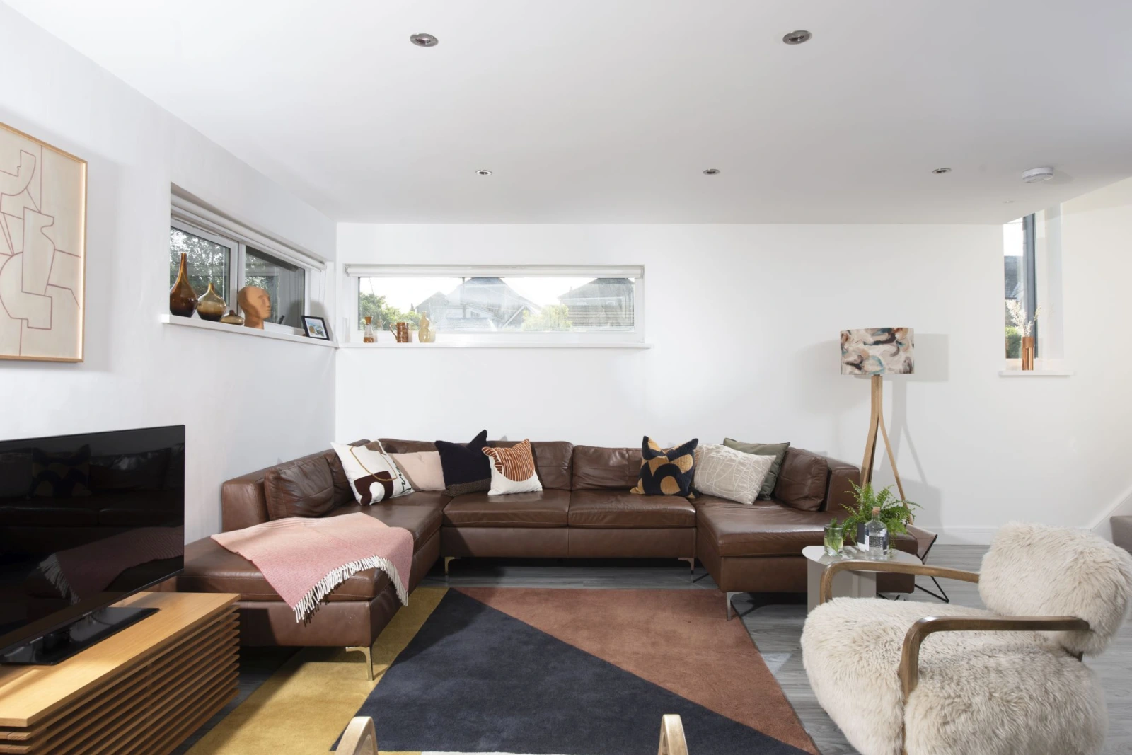 Living space with large leather corner sofa, Smart TV - Estuary Watch