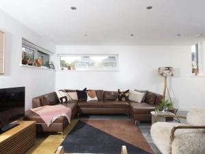 Living space with large leather corner sofa, Smart TV - Estuary Watch