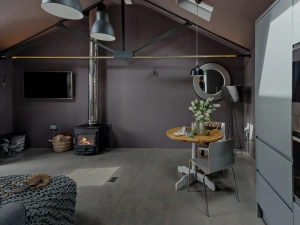 Living and dining space with TV and wood burner - The Beam