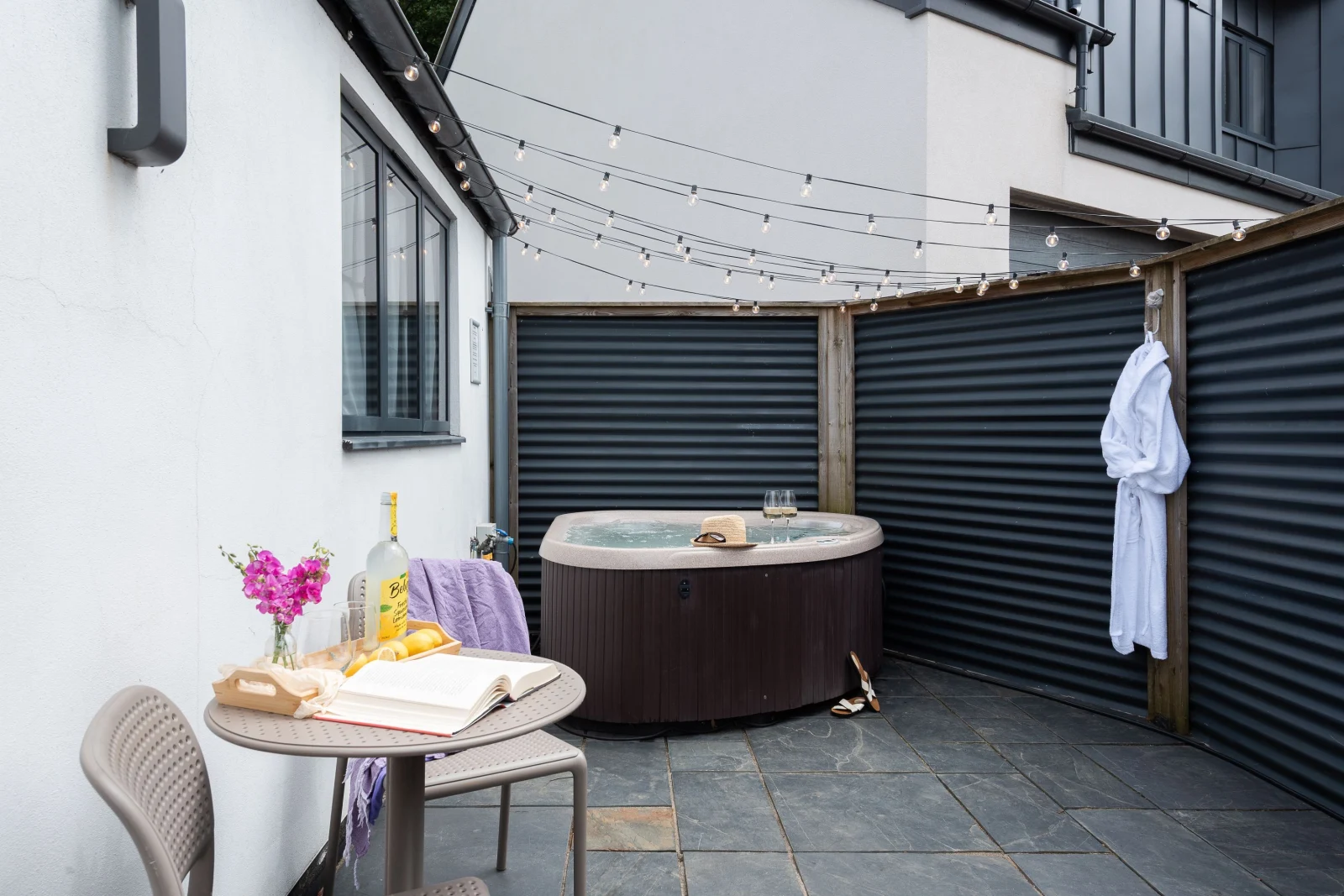 Patio with hot tub and outside seating - The Beam