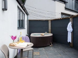 Patio with hot tub and outside seating - The Beam