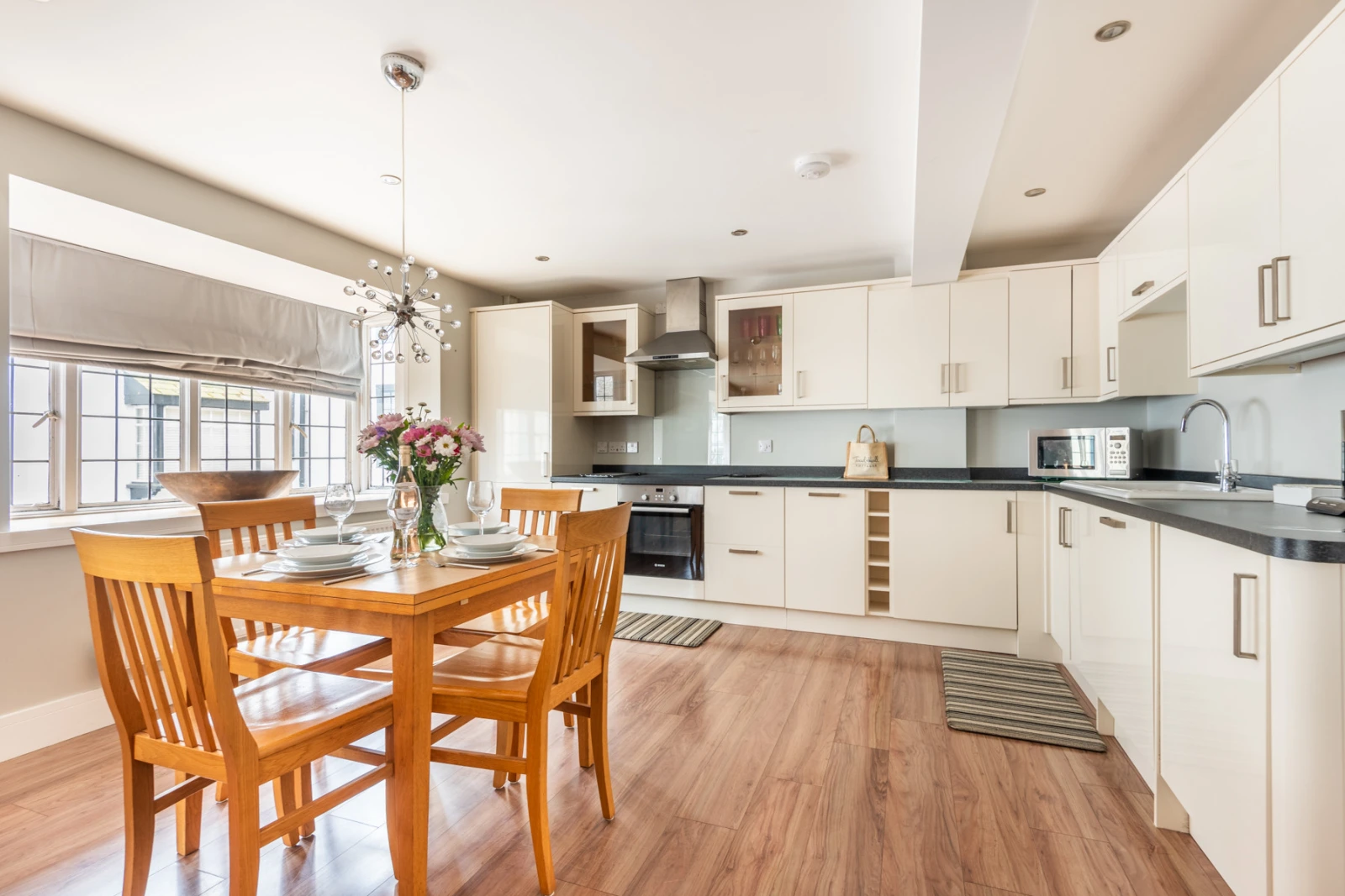 Open plan dining area and fitted kitchen