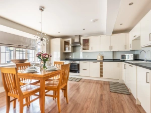 Open plan dining area and fitted kitchen