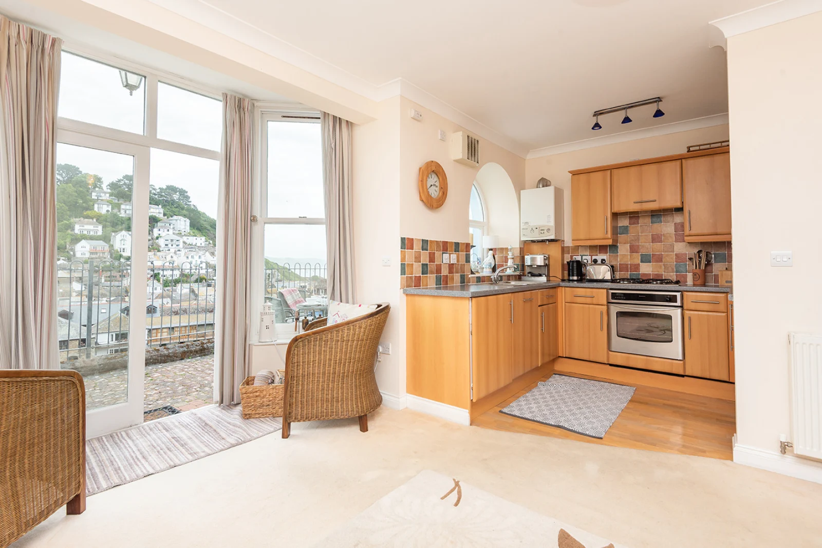 The open plan living space with french doors to terrace