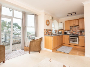 The open plan living space with french doors to terrace