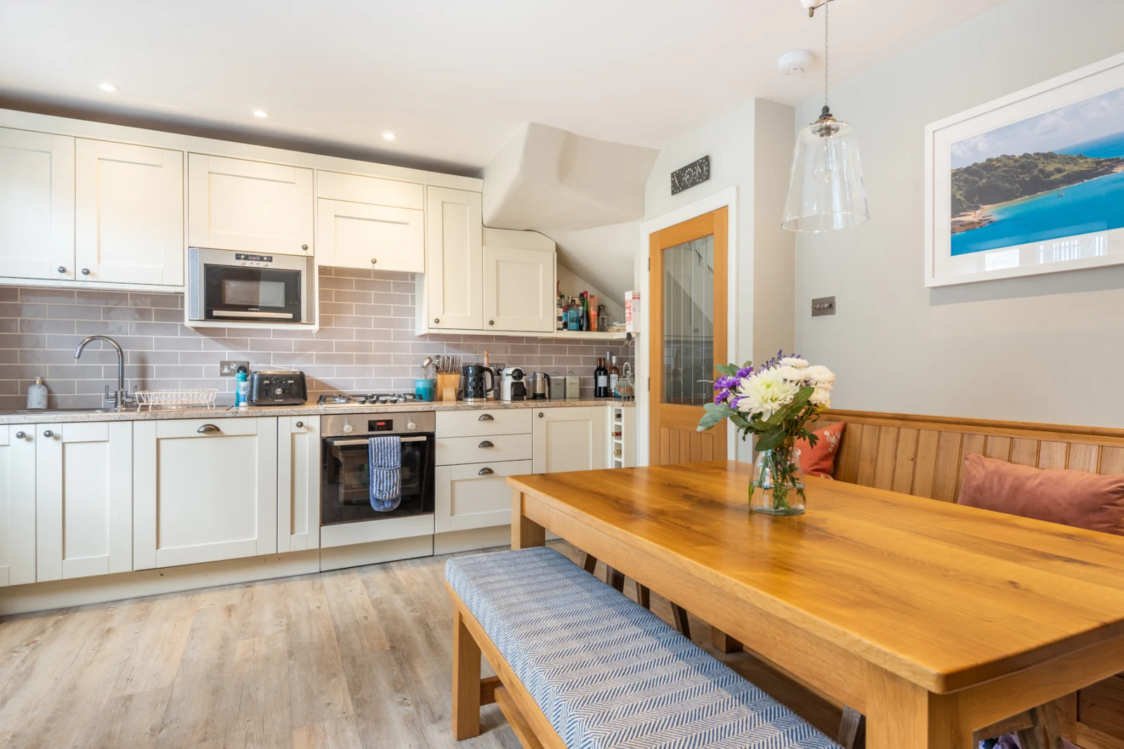 Another view of the kitchen and dining area