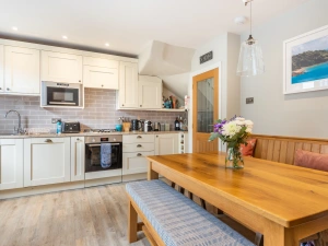 Another view of the kitchen and dining area