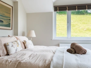 Bedroom 2-the master suite on the first floor with views across the village and countryside to Salcombe.