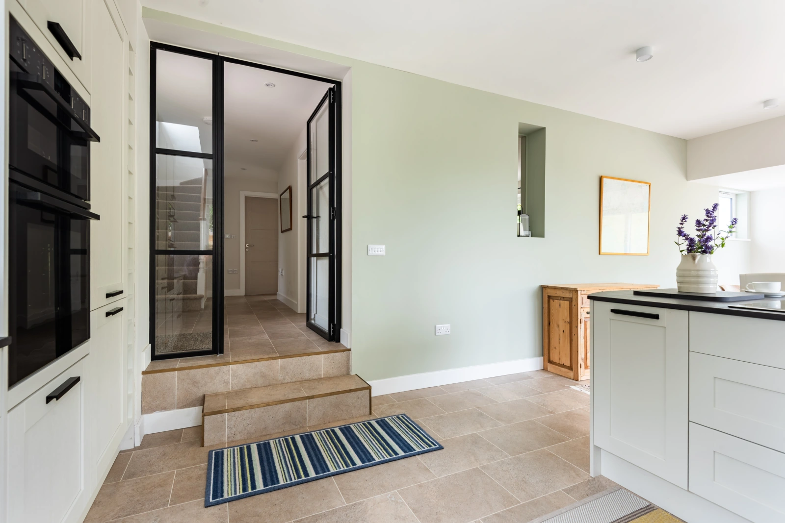 Step down from the hall into the spacious kitchen diner