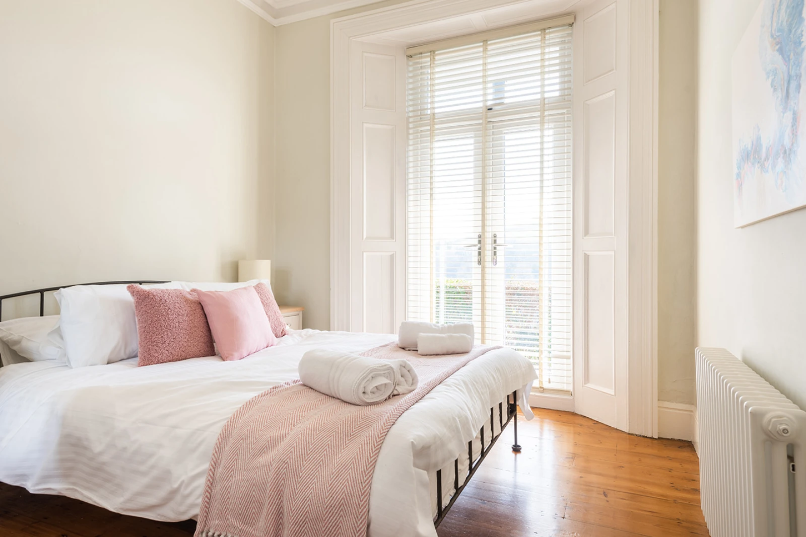 Bedroom 2 with 5ft king bed and patio doors to front terrace.
