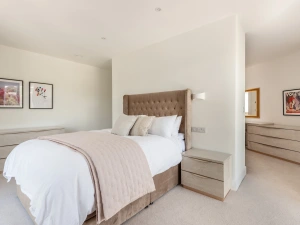 Bedroom 1-beautiful master suite with floating wall to create a dressing area