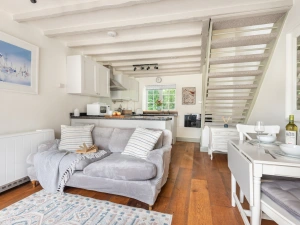 Open plan kitchen, dining set and sitting room. 