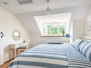 Bedroom with dormer window and 5ft king size bed. 