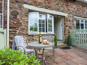 Paved patio with table and chairs. 