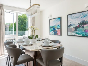 Stylish dining space with doors leading to the terrace