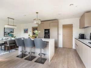Contemporary kitchen with utility room leading off it
