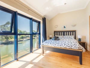 Spacious main bedroom with estuary views and en suite shower