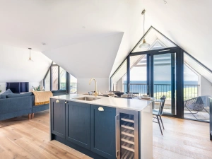 The open plan living area with stunning views and two balconies. 