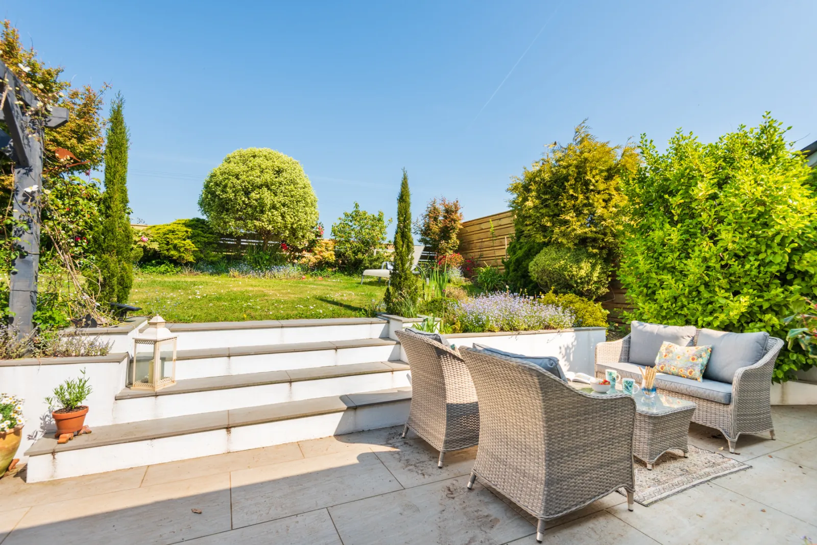 The sunny terrace with both relaxed seating and dining space