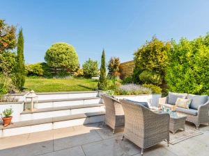 The sunny terrace with both relaxed seating and dining space