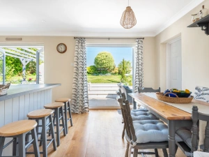 The dining area and breakfast bar looking out over the lovely garden