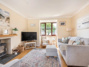 The living area with log burner perfect for relaxing any time of year.