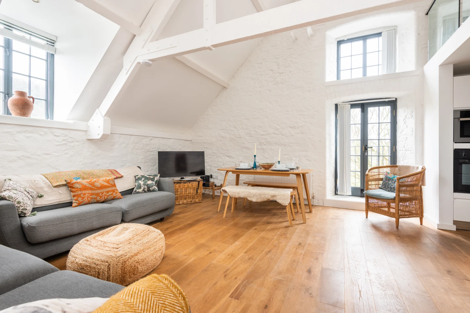 Stylishly presented galleried sitting room with vaulted ceilings and Juliet balcony.