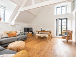 Stylishly presented galleried sitting room with vaulted ceilings and Juliet balcony.