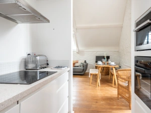 Galley kitchen through to the dining and sitting room.
