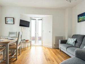 Cosy up on a winters day or relax in the cool and let the sea breeze whisper through the doors