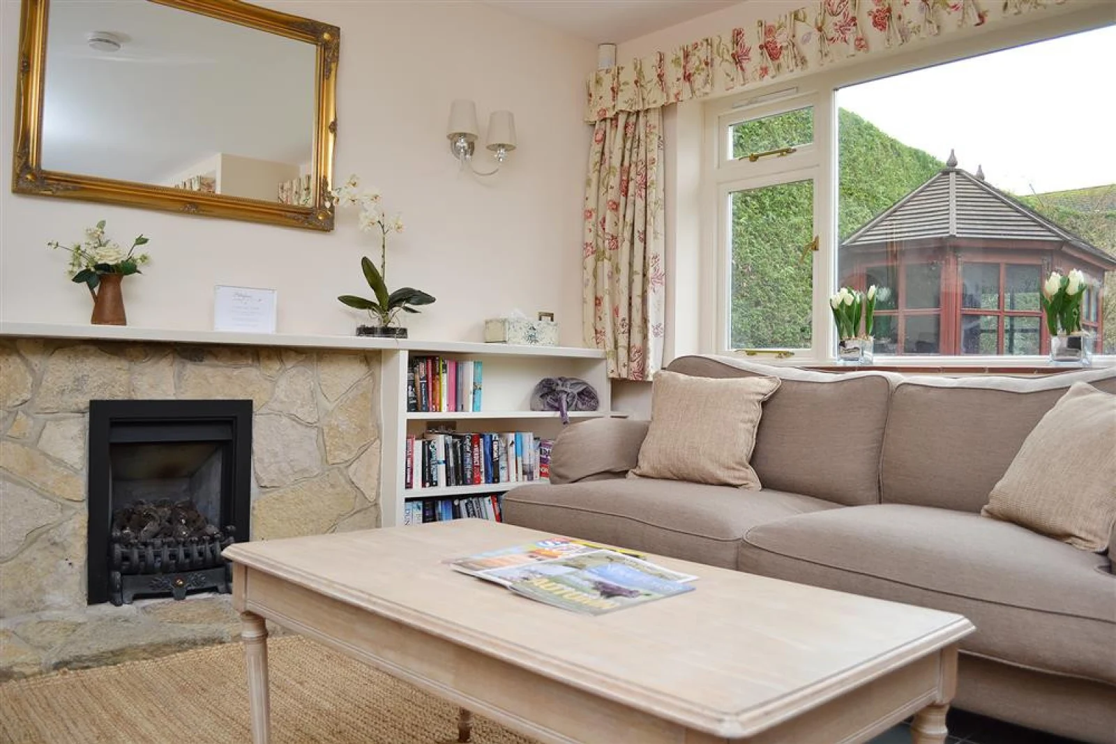Living area with windows overlooking the garden